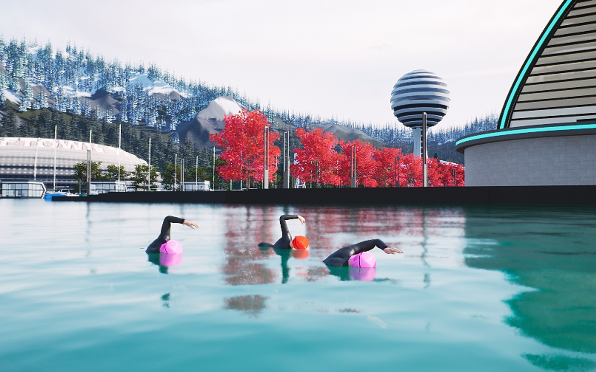 Swimmers in wetsuits in the SWYMLINE Lake, with red trees and mountains behind
