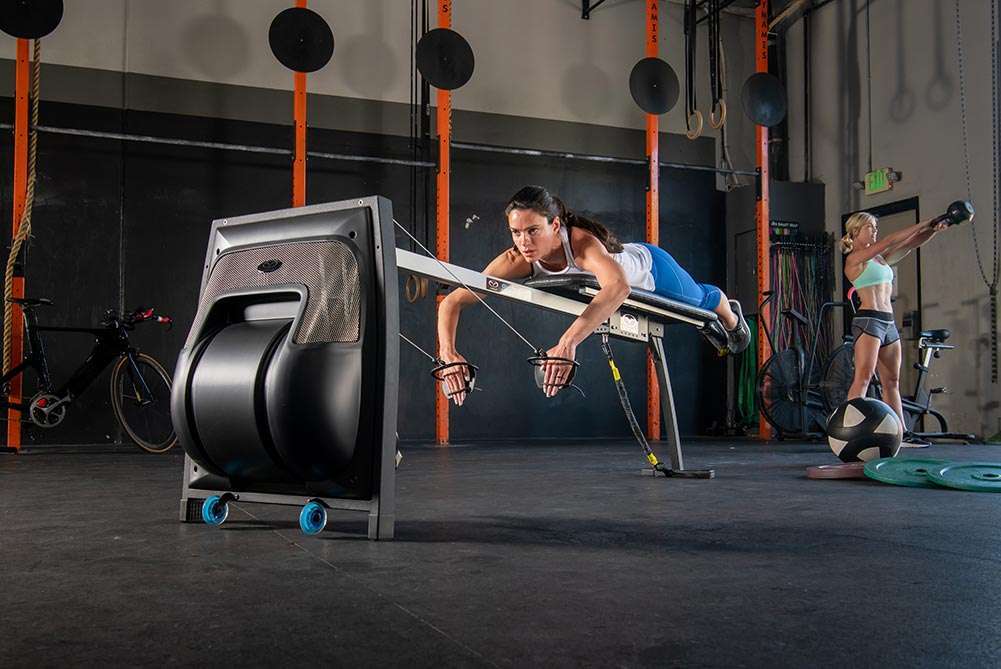 An athlete training on the Vasa Swim Erg in a gym
